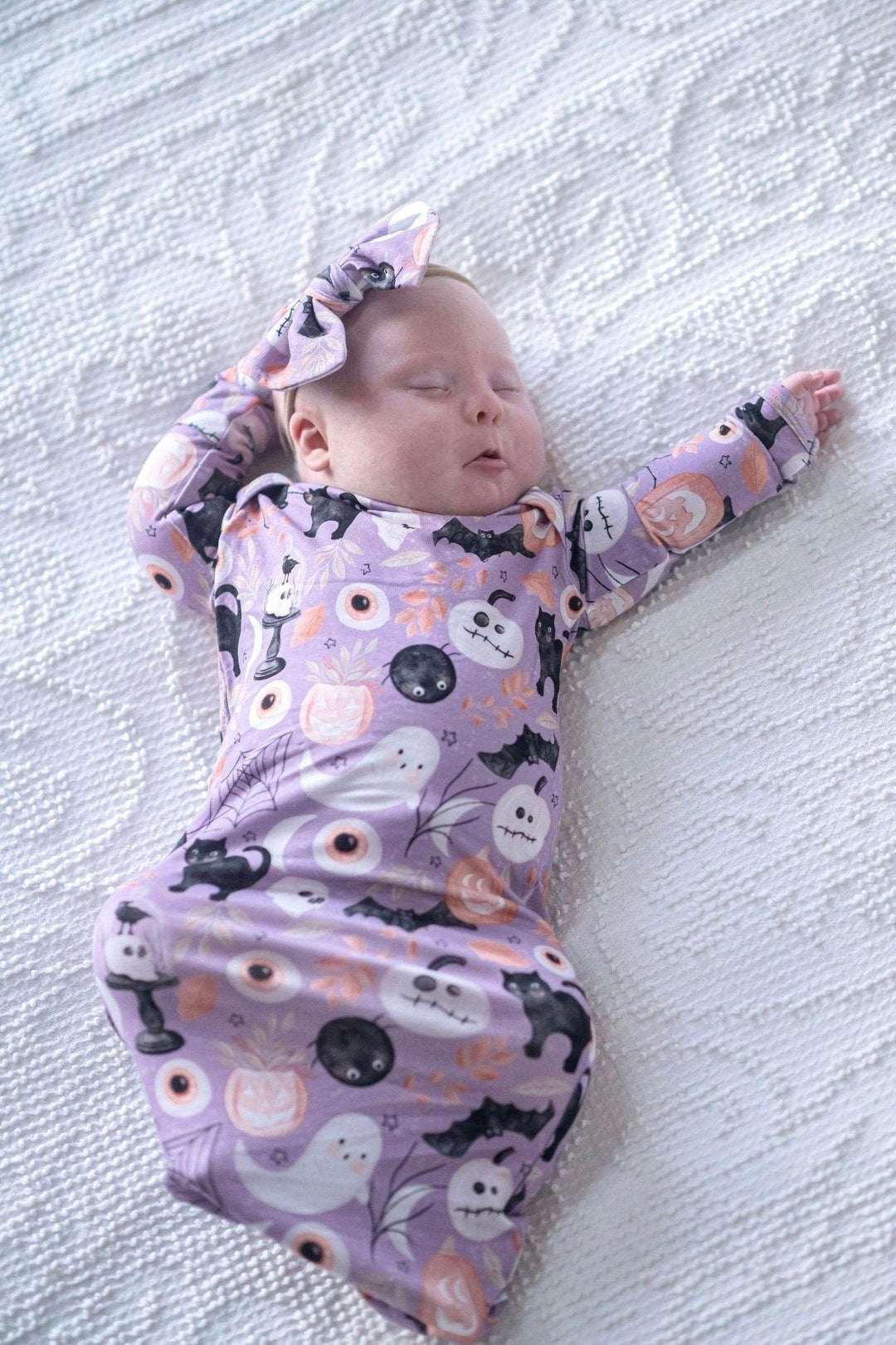Celebrate Baby's First Halloween with our festive Newborn Knotted Gown