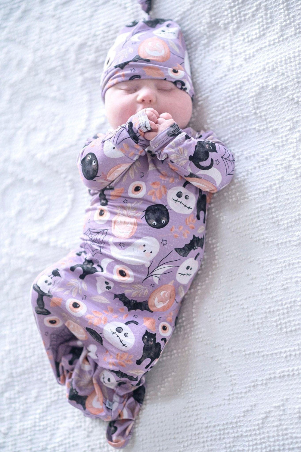 Celebrate Baby's First Halloween with our festive Newborn Knotted Gown